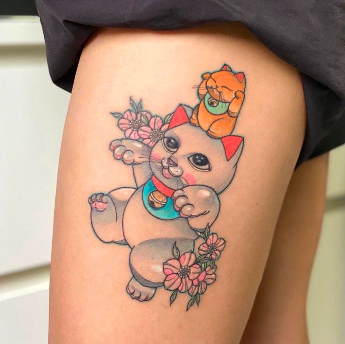 Hình xăm mèo thần tài ở đùi